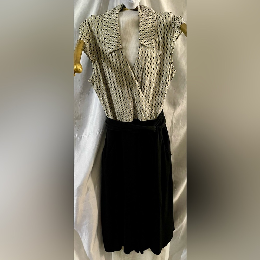 Cap sleeve faux wrap dress with sash.